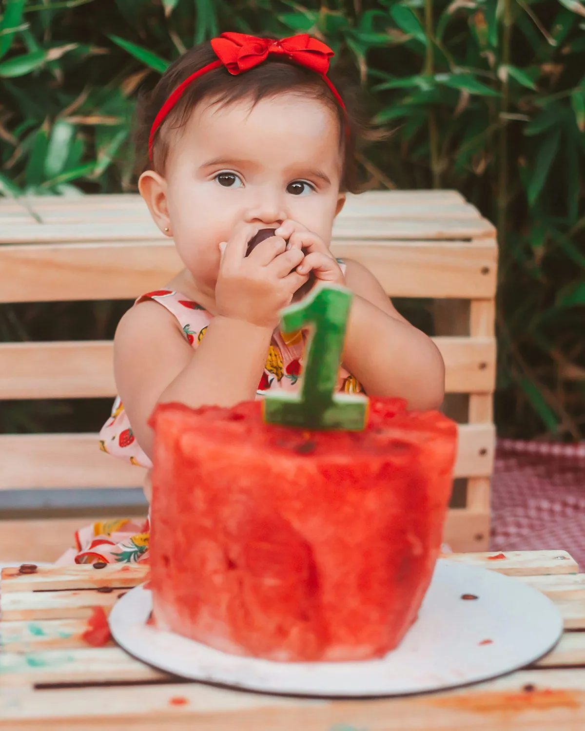 baby eating watermelon cake