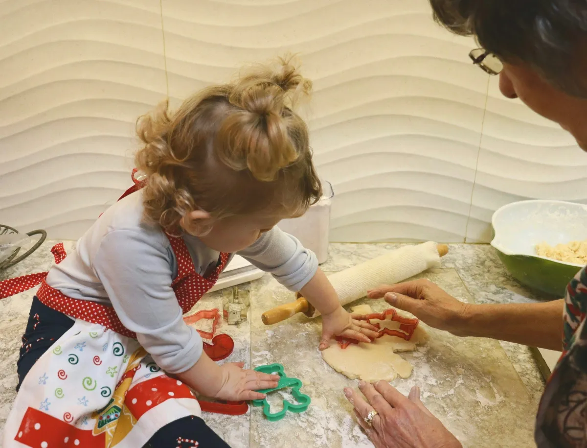 Little girl helping to make cookies 