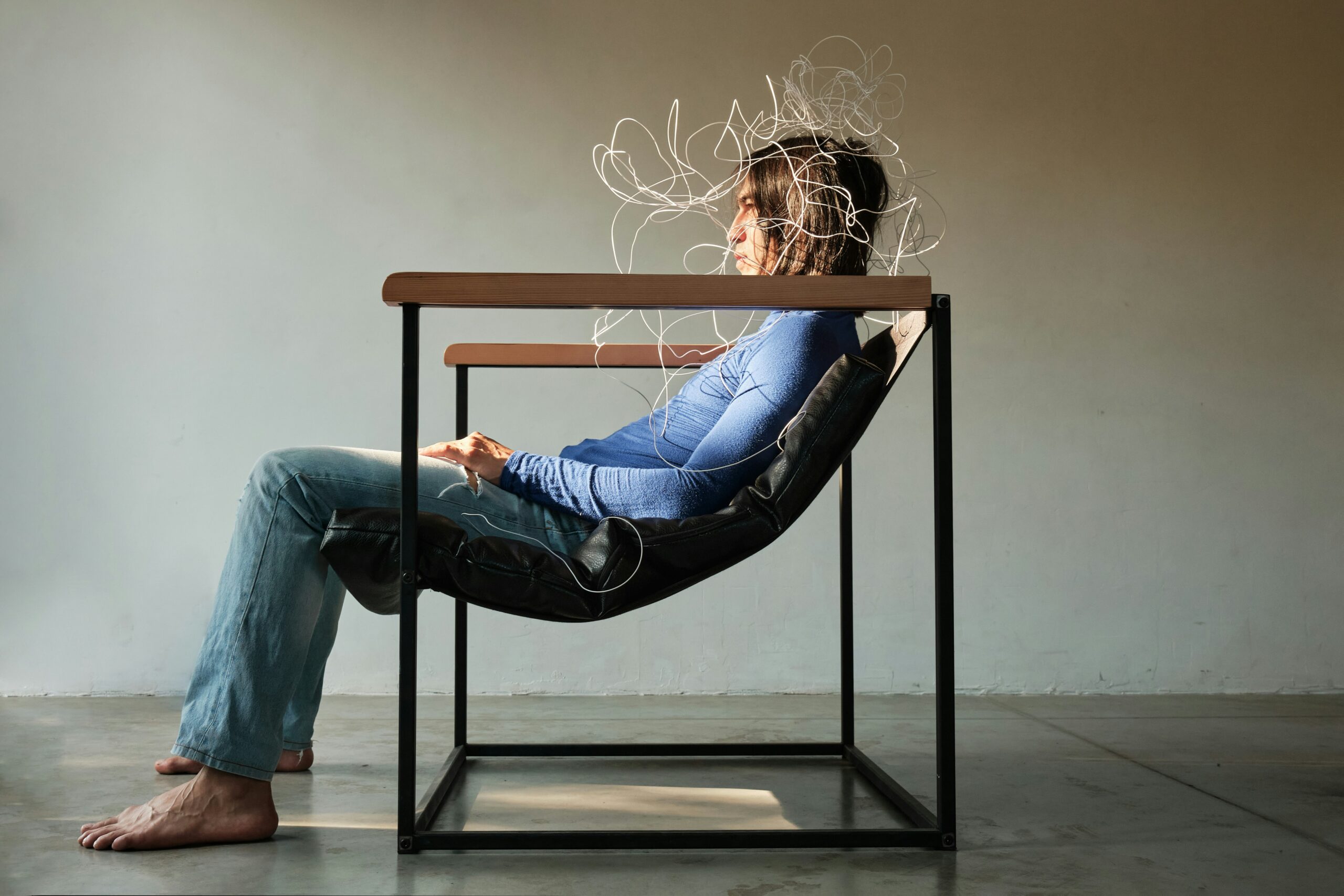 Person sittin gin a chair with confusion 